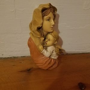 I am selling a mom holding her little baby.